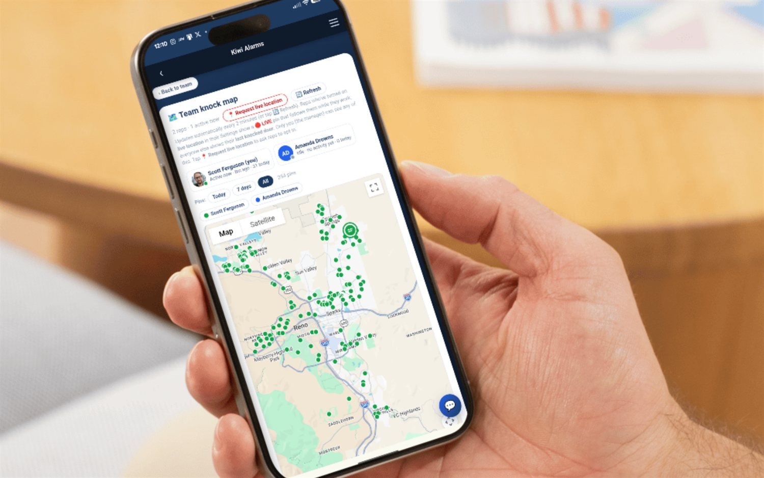 FieldStacker team knock map on a phone — every rep's GPS-verified knocks as live pins across the territory, with a roster showing who's active now